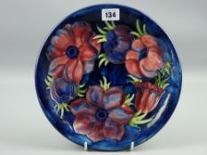 A 26 cms diameter Moorcroft Anemone plate with painted and impressed factory marks to the base