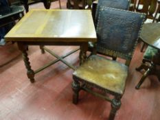 An oak barley twist draw leaf table with cross stretcher along with a pair of oak chairs on carved