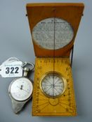 A 19th Century boxwood pocket sundial and compass with circular inset paper instruction and equation