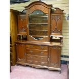 A late 19th/early 20th Century mahogany display sideboard having a wavy arched top section and
