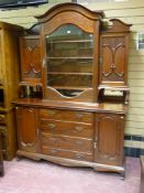 A late 19th/early 20th Century mahogany display sideboard having a wavy arched top section and