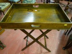 An oak butler's tray on stand, twin handled deep tray 70 x 44 cms, 8 cms deep on a folding wooden