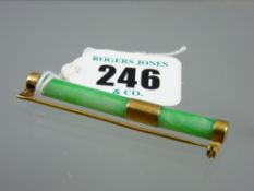 A jade baton shaped bar brooch with gold band and end sections, one stamped '18' and 'LS', the other