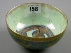 A Daisy Makeig-Jones Wedgwood lustre bowl, mottled green exterior with gilt bands and dragons, pearl