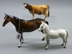 A Beswick model of a cow titled 'Newton Twinkle' (two legs re-glued), a dapple grey model of a Welsh
