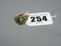 A fifteen carat gold double horseshoe ring having seed pearls and aquamarines, 2.8 grms