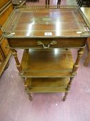 A French Empire style three tier stand with single top drawer, pierced brass gallery top and