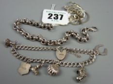 A silver charm bracelet, a snake chain with silver cross and a heavy link bracelet marked 925