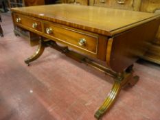 A quality reproduction mahogany sofa table, 56 x 102 cms closed (some staining to top)