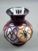 A Moorcroft Pansies purple ground with greeny blue interior, painted and impressed factory marks