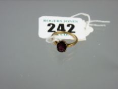 A nine carat gold garnet set ring, 1.6 grms total