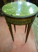 A French Empire style onyx circular top table with brass embellishments and fruit and floral pierced