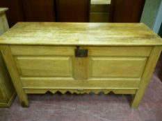 A European stripped pine lidded wedding chest with iron clasp and lock, raised chamfered panels