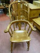 A 19th Century Windsor splatback smoker's bow armchair, 104 x 66 cms, later re-stained and re-