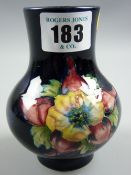 A Moorcroft Orchid cobalt blue ground squat baluster vase, 10.5 cms high, Moorcroft paper label to