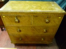 A Victorian scumbled pine chest of two short over two long drawers raised on turned bun feet, 89 x