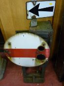 An antique cast iron railway signalling unit with interior paraffin burner, enamel swing directional