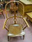 A 19th Century elm and ash stickback Windsor armchair with pierced central splat, 105 cms high, 60