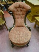 A well shaped Victorian walnut spoonback chair, button upholstered waisted back with circular seat