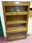An oak Wernicke style four stack sectional bookcase, 155 x 87 cms