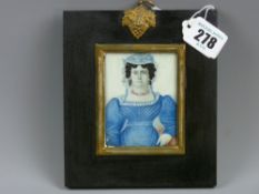 A miniature on ivory 19th Century half length study of a well dressed matriarch in a ribbon