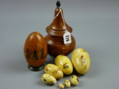 A treen onion shaped lidded container on three bun feet, 19 cms high and a treen Easter egg type