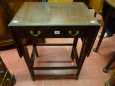 An Edwardian crossbanded mahogany and line inlaid twin flap gate leg side table with single front