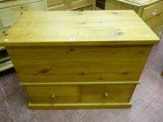 A 20th Century mule type pine chest, 77 cms high, 97 cms wide, 51.5 cms deep
