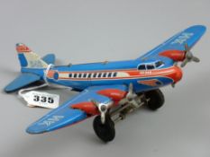 An HK542 tinplate airplane, a clockwork vintage lithographed toy by Huki, US Zone, Germany, 22 cms
