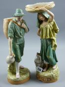 A fine pair of Royal Dux hand painted figures of a young man and woman carrying baskets and water