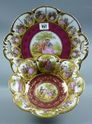Two Karlsbader china dessert pieces with floral and figural decoration - an oval plate and a