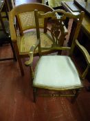 An Edwardian armchair with lyre splatback, turned supports and stretcher with stuffed pad seat and a