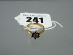 An eighteen carat gold sapphire cluster ring, 2.8 grms total