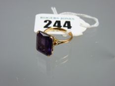 An eighteen carat gold and amethyst dress ring, 14 x 10 mm high set amethyst, 5.2 grms total