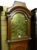 A 19th Century oak longcase, the pagoda top hood with turned door pillars and brass caps over a 12