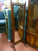 A Bevan & Funnell reproduction mahogany bevelled edge cheval mirror with urn finials, reeded splayed