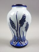 A Moorcroft Muscari blue on blue pattern waisted vase, 10 cms high, underglazed blue and impressed