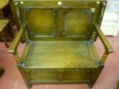 A 20th Century oak Jacobean style monk's bench interior maker's label 'Fyne Ladye', 72 x 91.5 cms