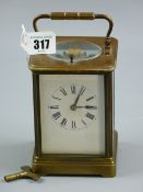 A brass cased repeater carriage clock, late 19th/early 20th Century, black Roman numerals on a white