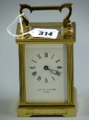 A brass carriage clock, 20th Century Mappin & Webb London carriage clock set within a brass and