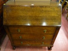 A clean 1930's oak fall front bureau chest on block and turned supports, 100 x 89 cms