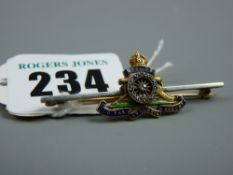 A gold and enamel diamond set Royal Artillery officer's sweetheart brooch, 45 cms, 4 grms total