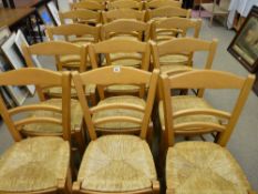 A good set of eighteen light wood rush seated chairs along with a quantity of upholstered metal