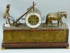 A good French gilt metal mantel clock having a ploughman and two horse team flanking a drum casing