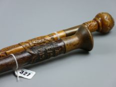 A deep carved wooden cane with regimental emblem and the words 'The Cheshire Regiment, Allies 1914/