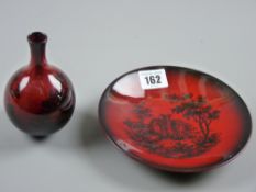 A small Doulton Flambe woodcut bottle vase, 11.5 cms along with a 15.5 cms diameter shallow dish