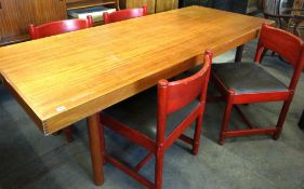 A retro teak rectangular dining table, 214cms x 92cms circa 1970s with four red painted chairs and