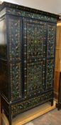 A Portuguese three piece ebonised and painted provincial bedroom suite comprising wardrobe with