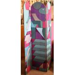 A reversible silk covered three fold arch top screen composed of deco style patchwork and applique