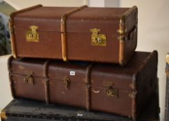 Two vintage banded travel trunks, one bearing old P & O Orient Lines and Britain by P & O travel